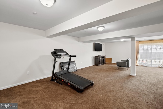 workout room featuring carpet and baseboards