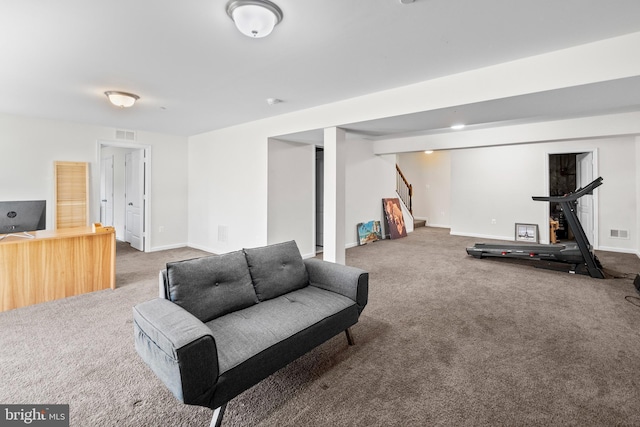 interior space featuring light carpet, visible vents, stairs, and baseboards