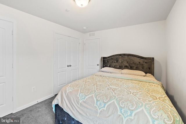 carpeted bedroom with visible vents and baseboards