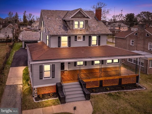 view of front of home featuring stairway and a chimney