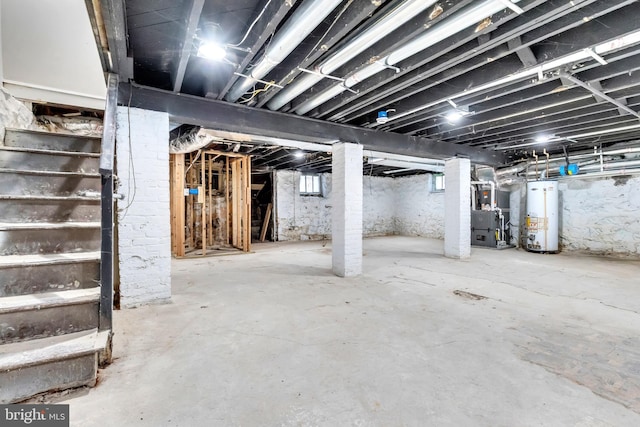 basement with water heater and heating unit