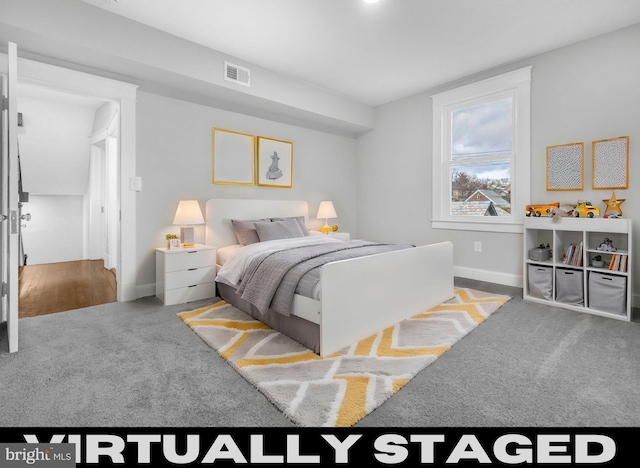 bedroom featuring carpet, visible vents, and baseboards