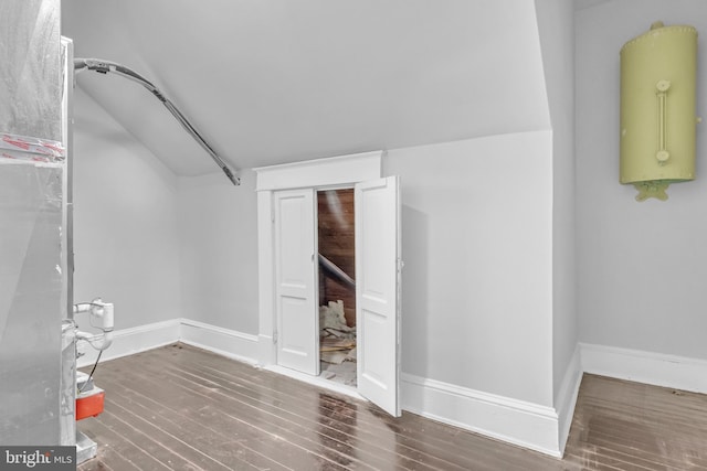 interior space with wood finished floors and baseboards