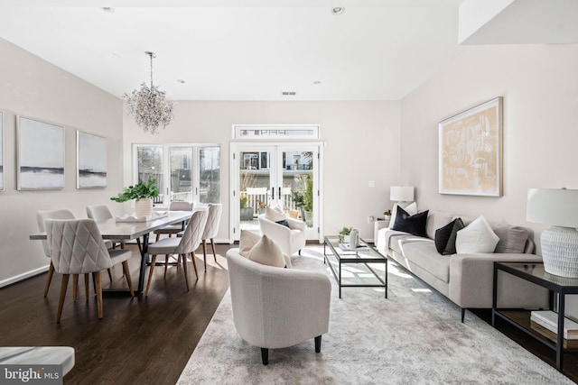 living area featuring dark wood-style floors, french doors, recessed lighting, a chandelier, and baseboards