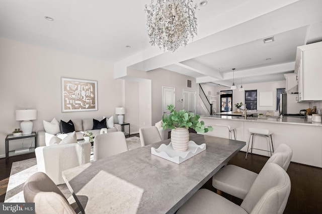 dining room with an inviting chandelier, dark wood finished floors, visible vents, and recessed lighting