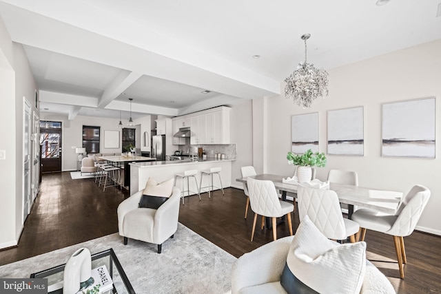 dining space with baseboards, dark wood-type flooring, beam ceiling, and a notable chandelier