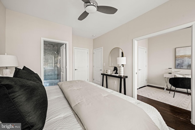 bedroom with ceiling fan, ensuite bath, wood finished floors, and baseboards