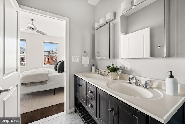 bathroom featuring double vanity, marble finish floor, ensuite bath, and a sink