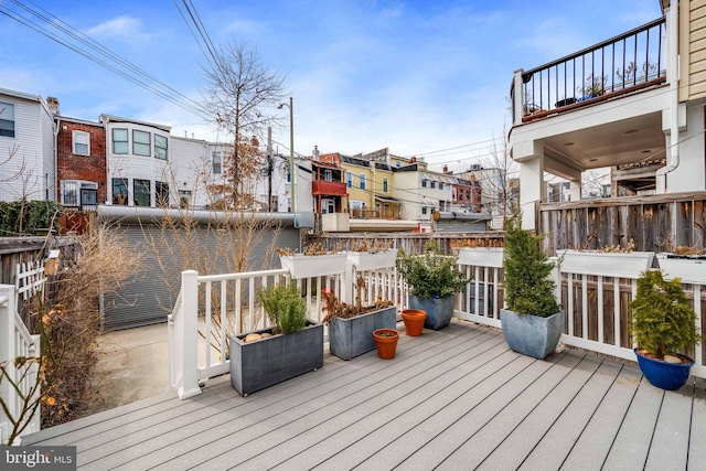 wooden deck featuring a residential view