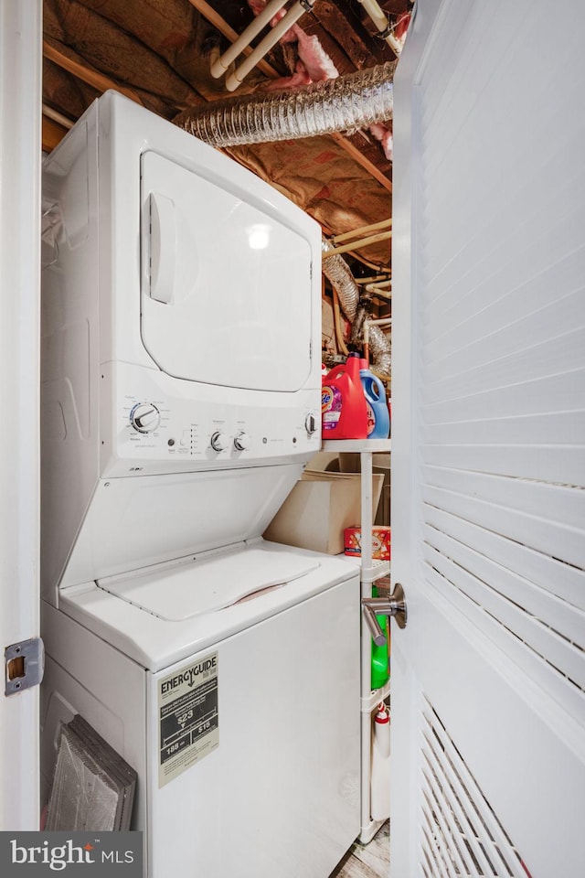 laundry area featuring laundry area and stacked washer and clothes dryer