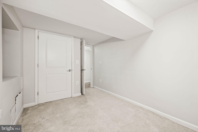 interior space with carpet flooring and baseboards