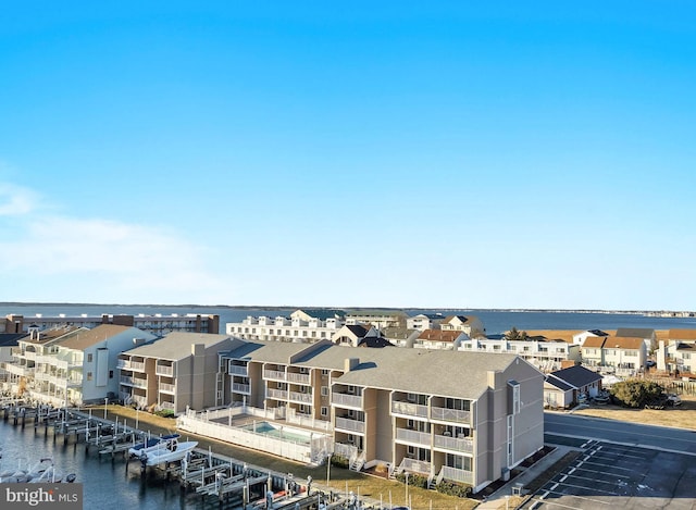 aerial view with a water view and a residential view