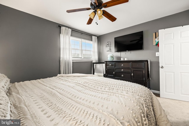 bedroom featuring carpet, a ceiling fan, and baseboards