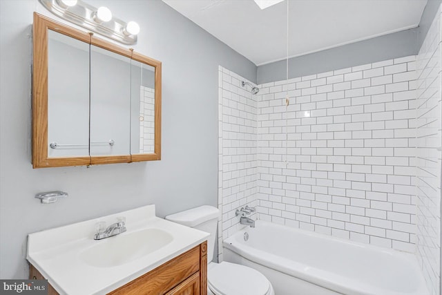 bathroom featuring shower / bathing tub combination, vanity, and toilet