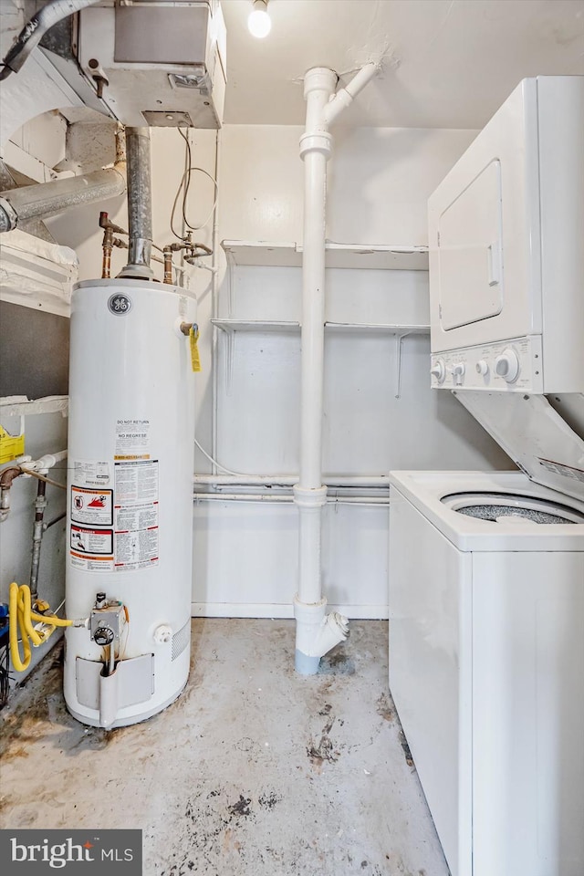 utilities with stacked washer / dryer and gas water heater