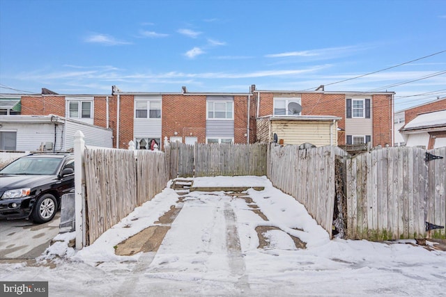 yard layered in snow featuring fence