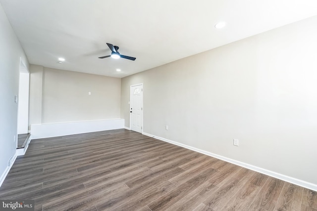 spare room with recessed lighting, baseboards, dark wood-type flooring, and ceiling fan