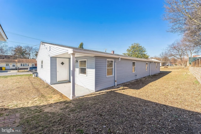 back of property featuring fence