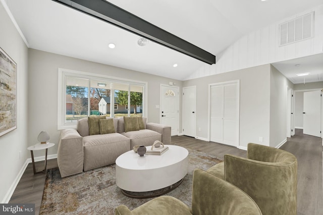 living room with visible vents, lofted ceiling with beams, baseboards, and wood finished floors