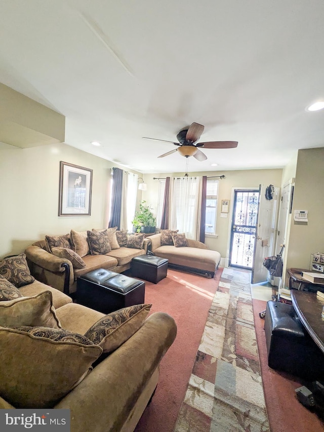 living area featuring recessed lighting and ceiling fan