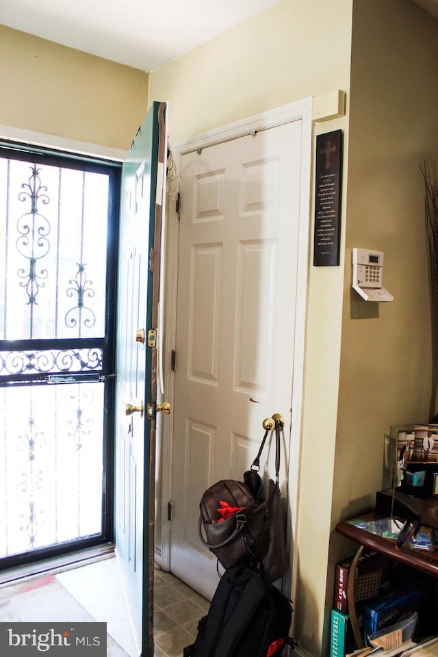 foyer featuring light tile patterned flooring