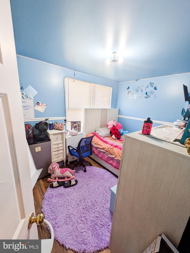 bedroom with wood finished floors