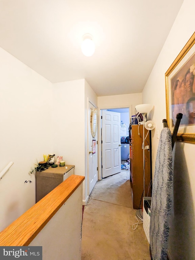 hallway featuring concrete flooring