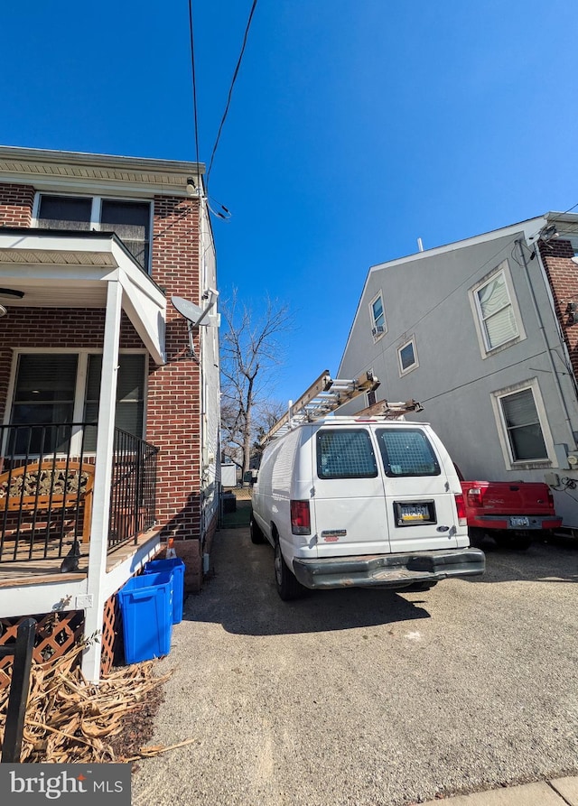 view of side of home featuring brick siding