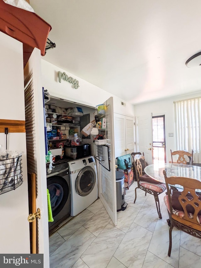 laundry area with laundry area, visible vents, marble finish floor, and washer and clothes dryer