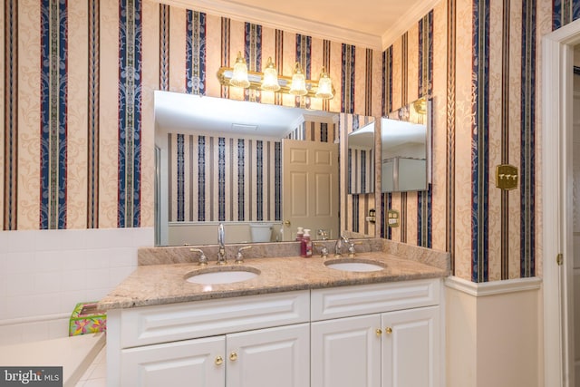 bathroom with a sink and wallpapered walls