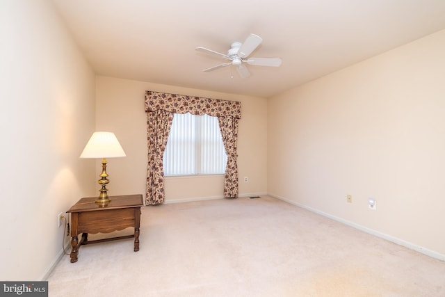 sitting room with visible vents, baseboards, ceiling fan, and carpet floors