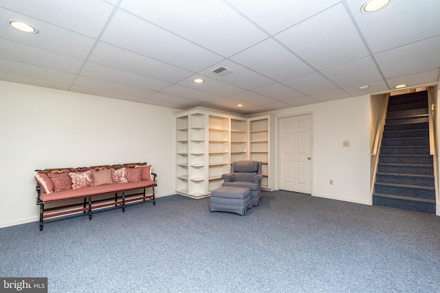 sitting room with baseboards, visible vents, carpet floors, recessed lighting, and stairs