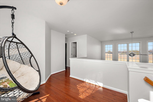 interior space featuring hardwood / wood-style flooring and baseboards