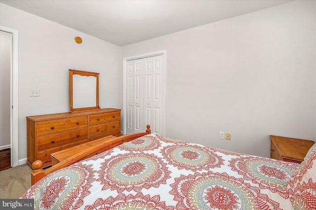 bedroom with carpet and a closet