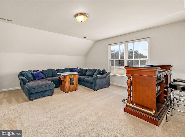 living room featuring light carpet, vaulted ceiling, visible vents, and baseboards