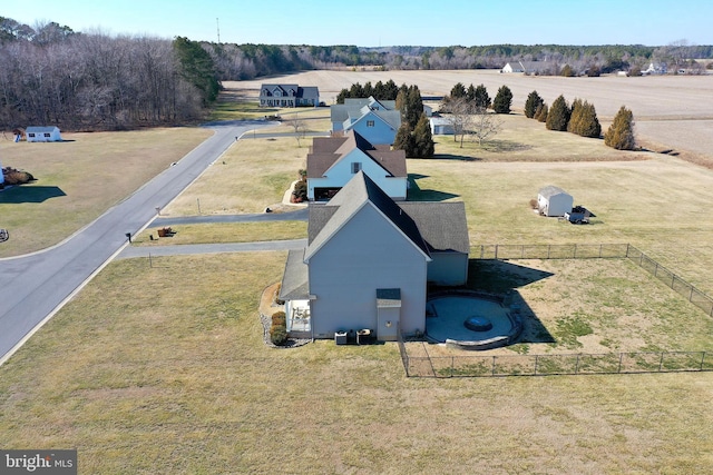 birds eye view of property with a rural view