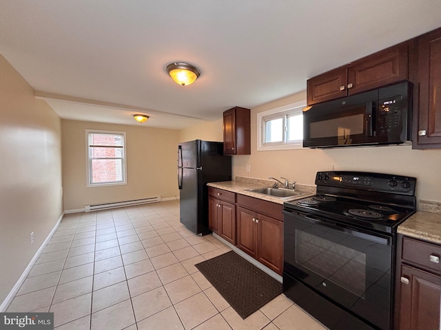 kitchen featuring black appliances, a baseboard radiator, light tile patterned floors, and a sink