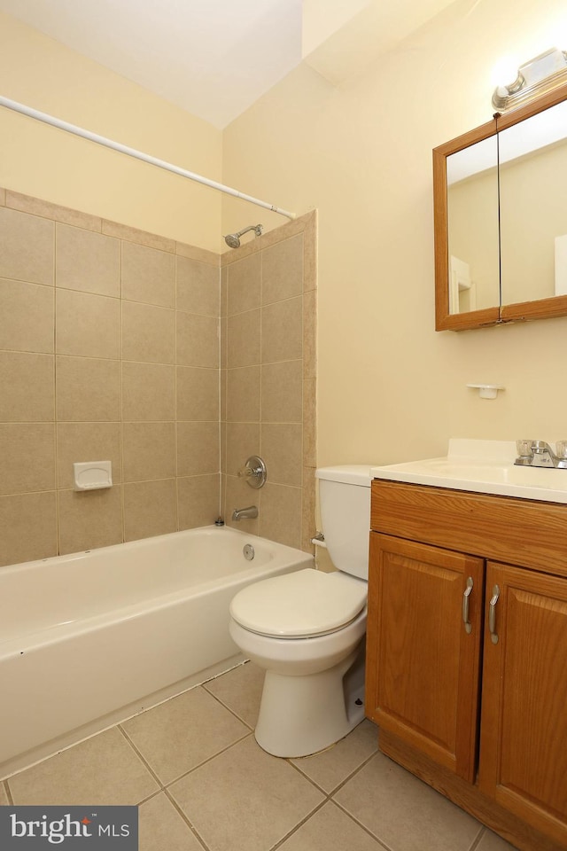 full bath featuring shower / bath combination, vanity, toilet, and tile patterned floors