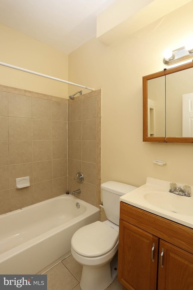 full bathroom featuring tub / shower combination, vanity, toilet, and tile patterned floors