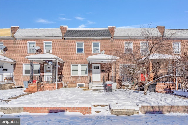 townhome / multi-family property featuring brick siding