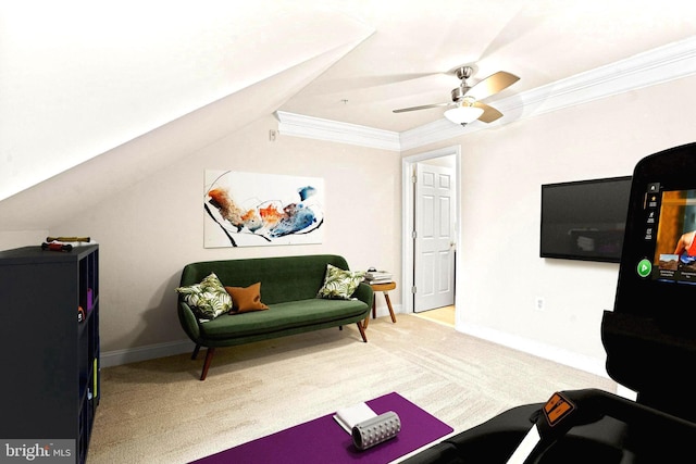 interior space with baseboards, lofted ceiling, ceiling fan, ornamental molding, and carpet floors