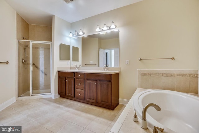 full bathroom with a stall shower, a garden tub, a sink, and double vanity