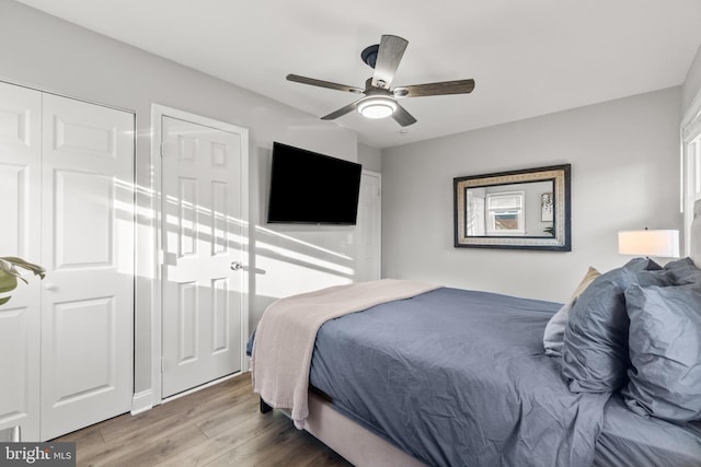 bedroom with a ceiling fan and wood finished floors