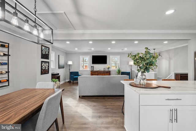 interior space with recessed lighting, crown molding, baseboards, and wood finished floors