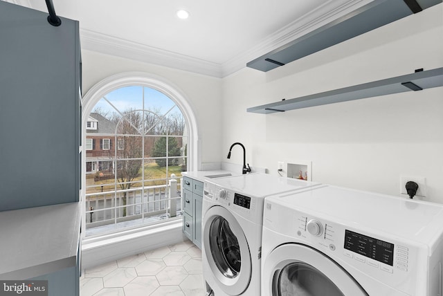 washroom with light tile patterned floors, ornamental molding, separate washer and dryer, a sink, and recessed lighting