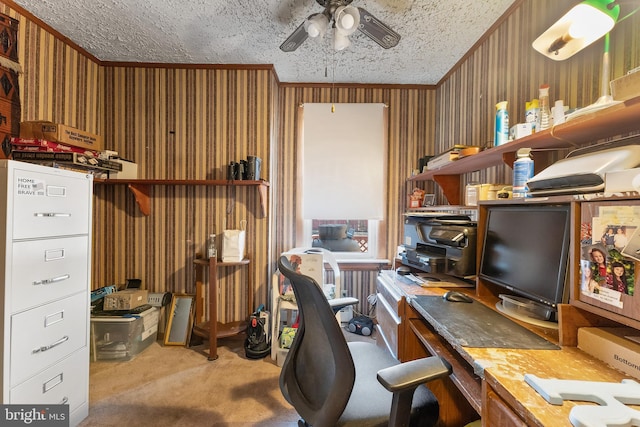 carpeted office with a ceiling fan, a textured ceiling, and ornamental molding