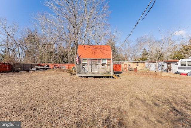 view of yard with fence and a deck