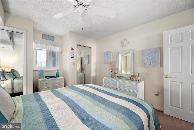 carpeted bedroom featuring a ceiling fan, baseboards, and a textured ceiling