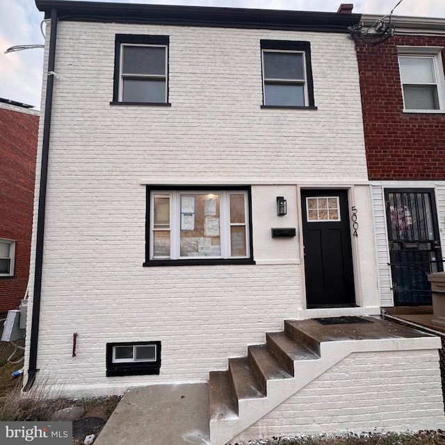 view of front of home with brick siding