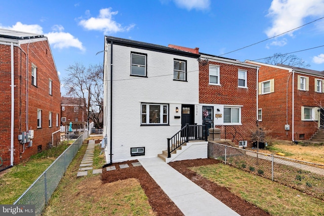 townhome / multi-family property with brick siding, central AC unit, and fence